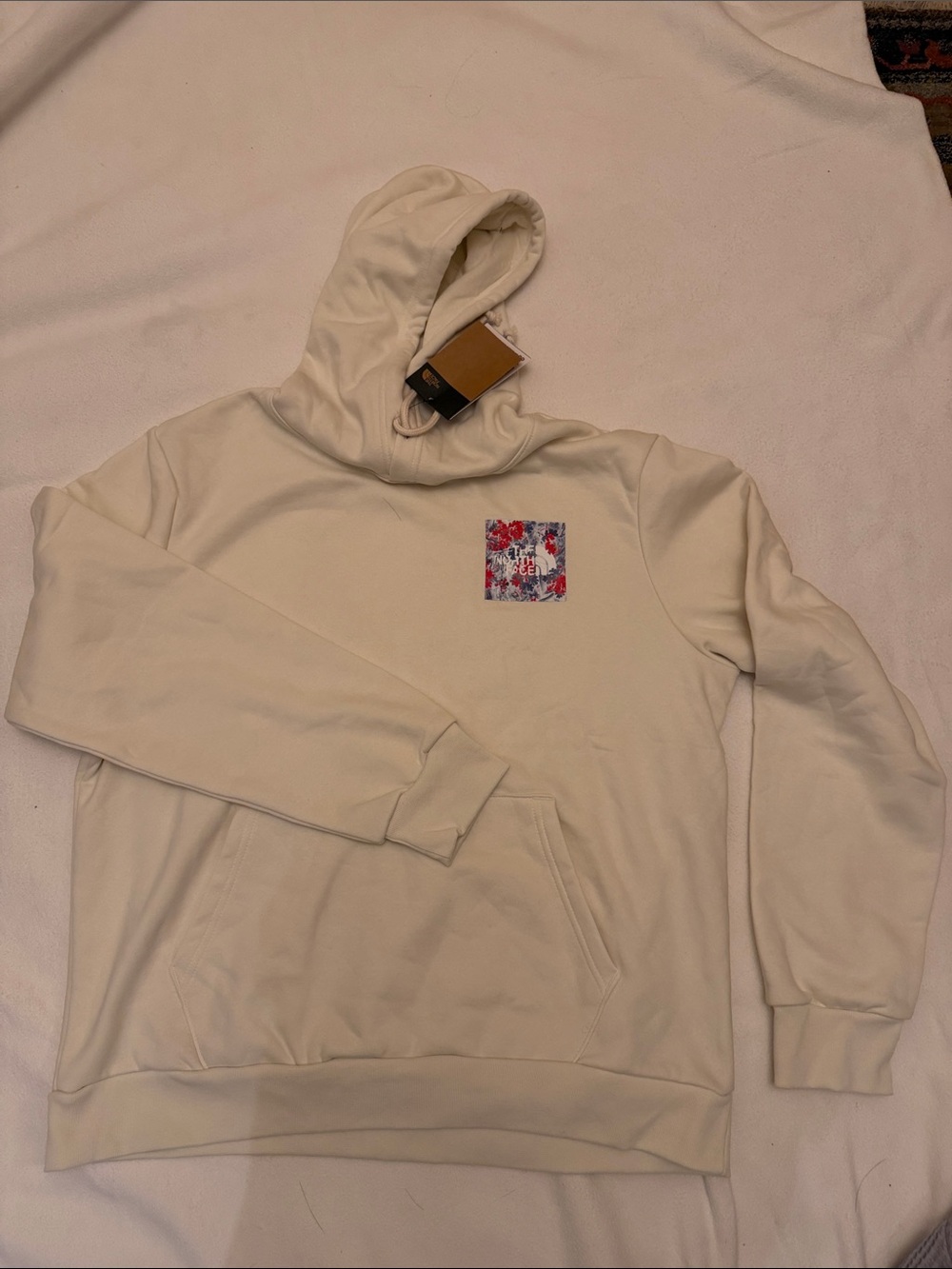 The North Face Cream Crewneck Hoodie with Floral Chest Patch